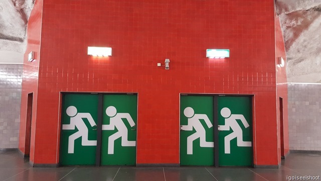 Emergency exits at the Universitetet station in striking colours.