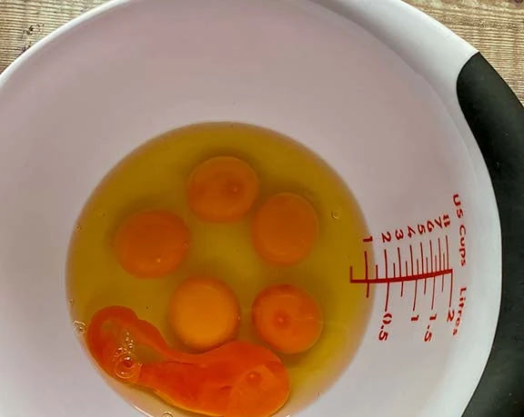 Eggs in a large bowl.