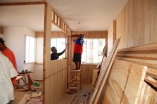 Mang Rey was installing the door jamb between the bedroom and the living room