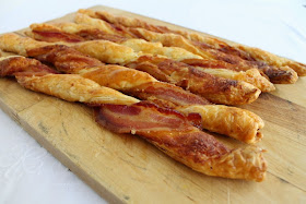 Food Lust People Love: Puff pastry spread with Dijon and sprinkled with Parmesan, then twisted with streaky bacon, is baked till it's crispy, puffed and golden. Bacon Parmesan Twists are a divine savory snack!