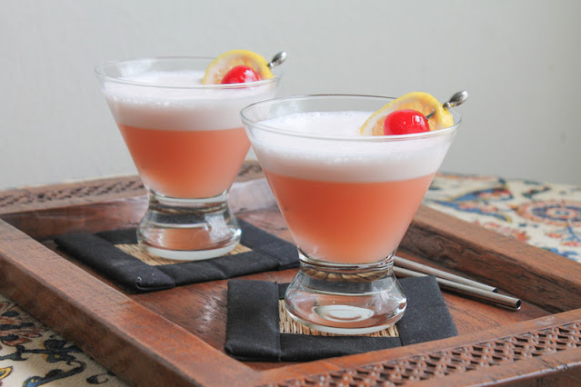 Food Lust People Love: Nicely tart, these Amaretto sour mocktails are made with pineapple, maraschino cherry and lemon juice. They are deliciously refreshing on a hot summer day.