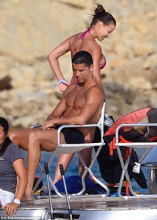 Cristiano Ronaldo Shows Off His Muscled Physique As He Enjoys Yacht Trip With Mystery Lady 
