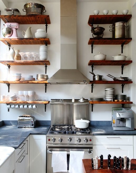 These timber shelves add to the warmth of this kitchen, which only 