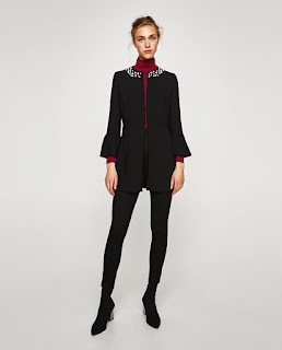 A strriking black frock coat embellished with a pearl collar from Zara