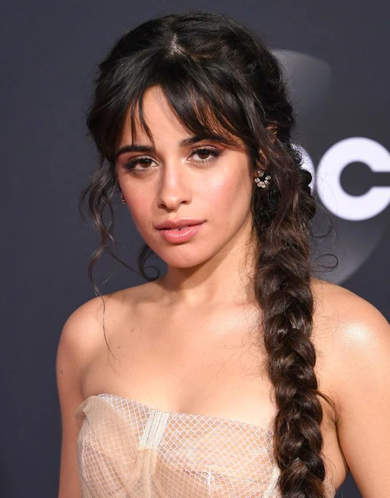 portrait of a beautiful woman with wispy bangs and styled hair