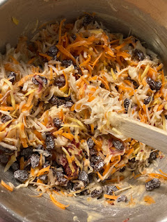 carrots and pineapple and raisins in a bowl for carrot cake