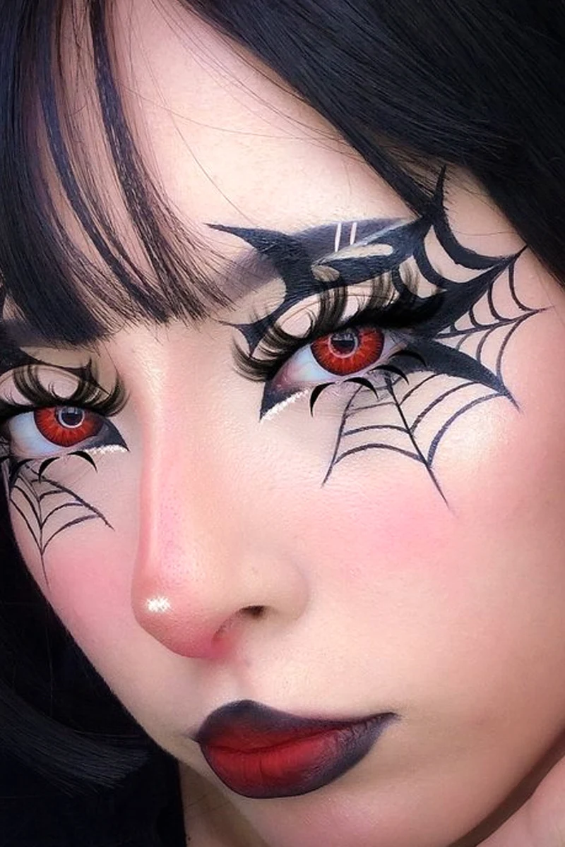 close-up portrait of a young, beautiful woman with goth eyeliner makeup look