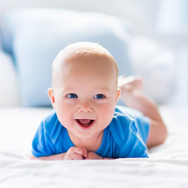 Cute Smiling Blue Eye Baby Boy Wallpaper