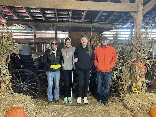 You, Nana, Andy, and Elizabeth standing side-by-side in the barn where we got our pumpkins from.