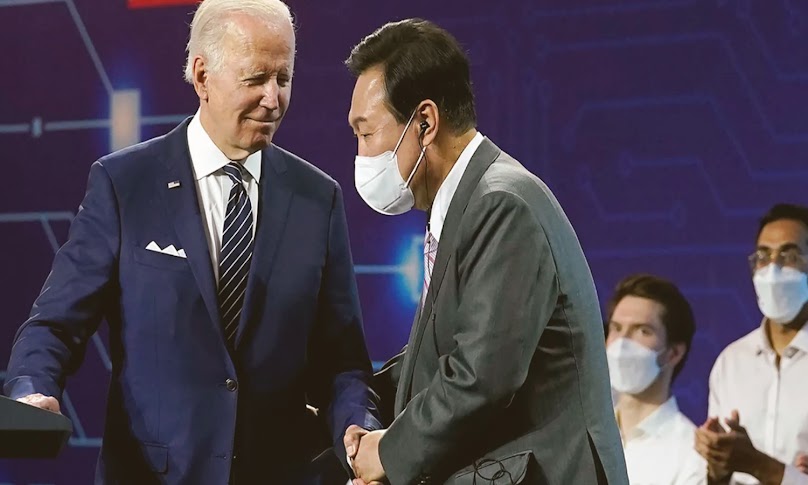 President Biden and South Korean President Yoon Suk Yeol speak during a visit to the Samsung Electronics Pyeongtaek campus on Friday, May 20, 2022, in Pyeongtaek, South Korea.