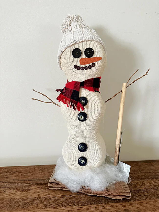 snowman with hat and shovel