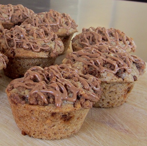 Food Lust People Love: These cinnamon gingernut muffins are baked with gingernut biscuits inside and as topping for the tender sweet and spicy muffin below. Add cinnamon glaze for an extra kick!