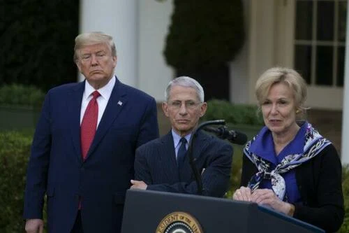 President Donald Trump and Dr. Anthony Fauci, director of the National Institute of Allergy and Infectious Diseases, listen to White House coronavirus response coordinator Dr. Deborah Birx speak in the Rose Garden at the White House in Washington on March 29, 2020.