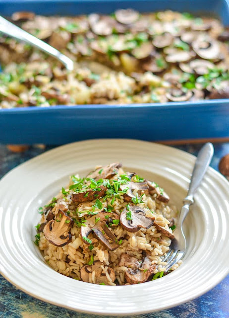 Cooked oven baked garlic mushroom rice in a white bowl