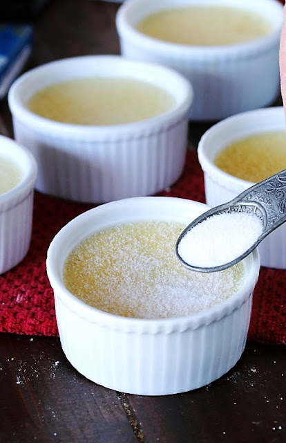 Sprinkling Sugar to Make Creme Brulee Topping Image