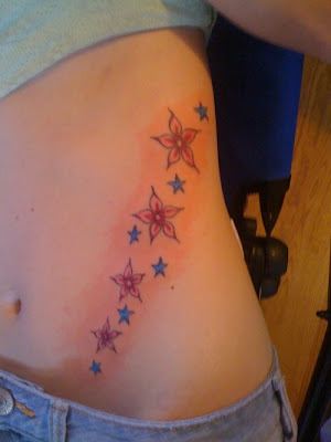 stars tattoos on side. side piece tattoos. stars