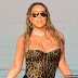 Mariah Carey Takes a Dip in Dead Sea in Cleavage-Baring Leopard Swimsuit
