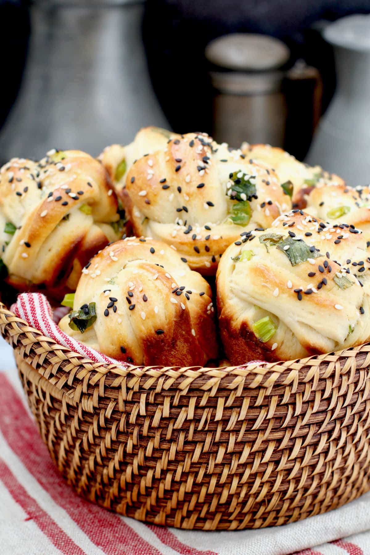 Scallion and Sesame Rolls in a basket.