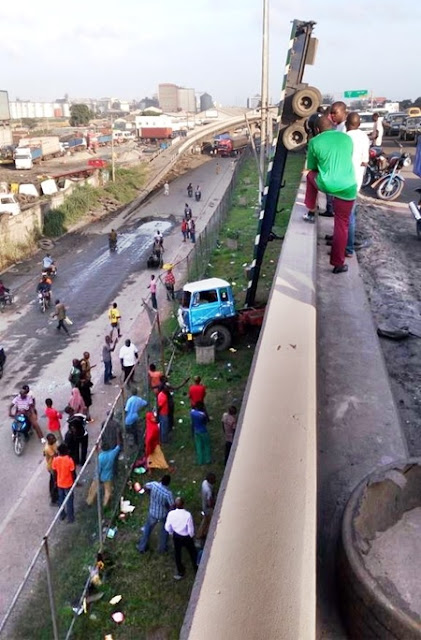 Tragic! See How a Trailer Fell Off the Apapa-Ijora Bridge in Lagos State (Photos)