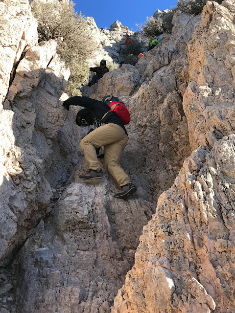 Downclimbing the chute on Muddy Peak