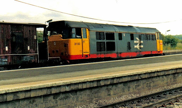 photo of class 31130 loco in br railfreight livery hauls brake van through wellingborough station 1990s