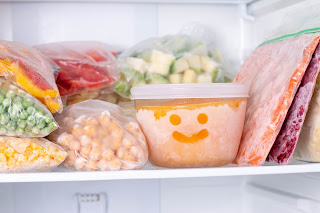 containers in freezer with container happy face