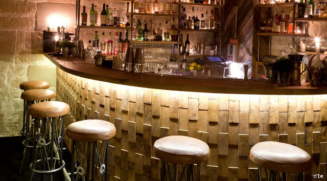 basement bar design ideas with wine racks and basment liquor shelves
