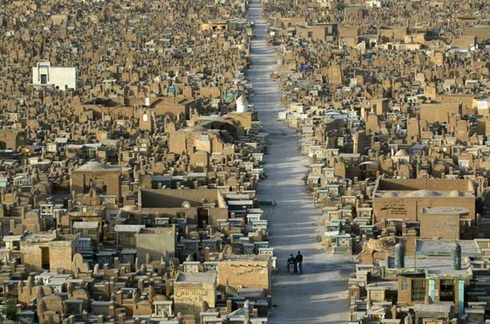 Wadi Al-Salaam (Valley of Peace) is an Islamic cemetery, located in Shia holy city of Najaf, Iraq. It is reputed to be the largest cemetery in the world. It is estimated more than half a million corpses are interred in the cemetery each year. The cemetery covers 1485.5 acres (6 km²) and contains millions of bodies. The cemetery holds the graves of many Muslims, and is located near the Shrine of Imam Ali ibn Abi Talib, the first Shia Imam and fourth Sunni Caliph. Thus, nearly all Shi'as in Iraq request that they be buried in this cemetery.