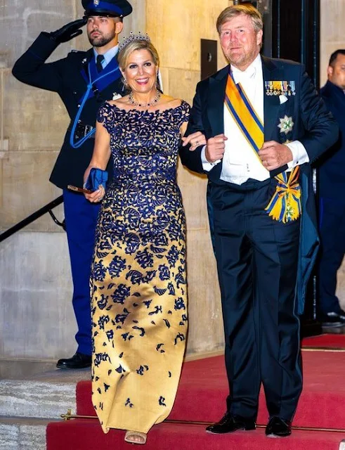 Queen Maxima wore a navy lace top and maxi skirt by Claes Iversen. Sapphire tiara, sapphire necklace and sapphire diamond earrings