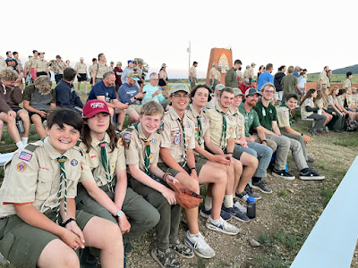 Group of boy scouts sitting together on a bench