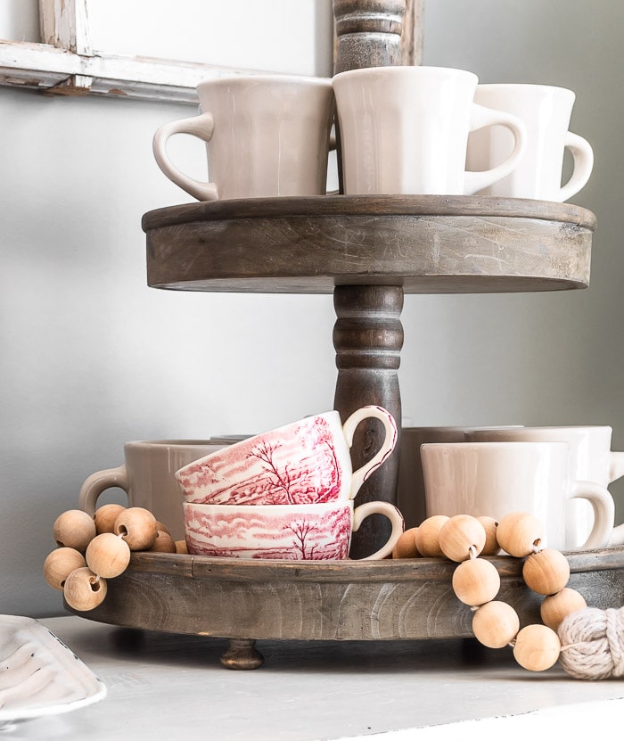 tiered tray, ironstone mugs, wood bead garland