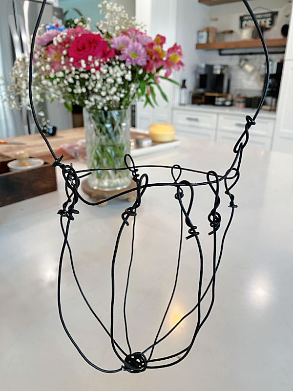 wire basket hanging with flowers