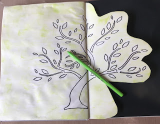 image tree outline in art journal with green pencil