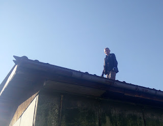 Sally grinning widely while on the Green Building roof