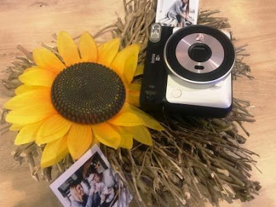 Instax SQ6 flatlay with sunflower