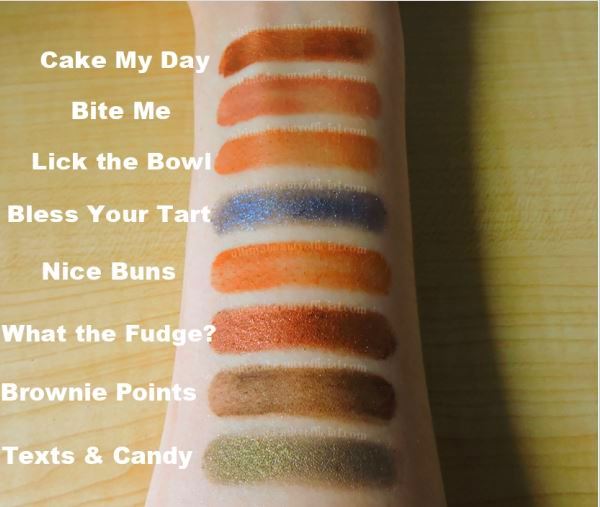Swatches of Too Faced Better Than Chocolate Eyeshadow Palette. Text Reads: "Cake My Day, Bite Me, Lick the Bowl, Bless Your Tart, Nice Buns, What the Fudge?, Brownie Points, Texts & Candy"