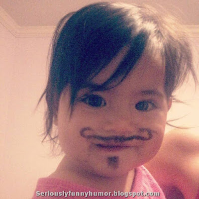 Hilarious girl with drawn mustache!