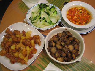 clockwise from lower left - orange chicken, baby bok choy, tomato egg, eggplant