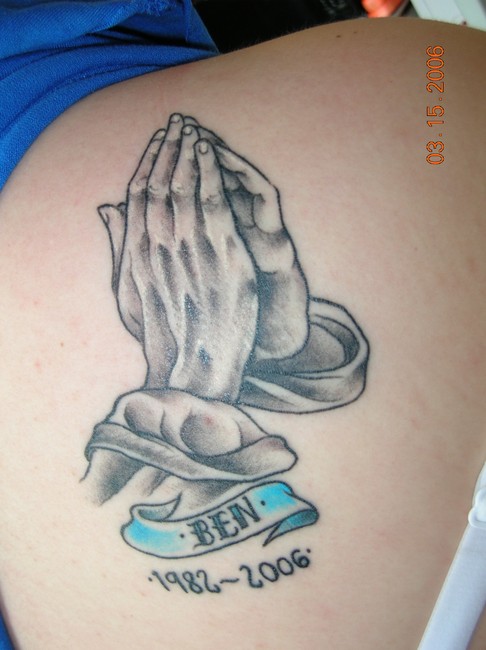 praying hands rosary tattoo. This praying hands tattoo is