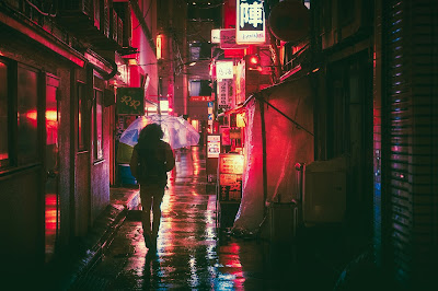 someone walking a street at night