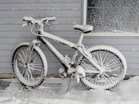 snow covered bicycle