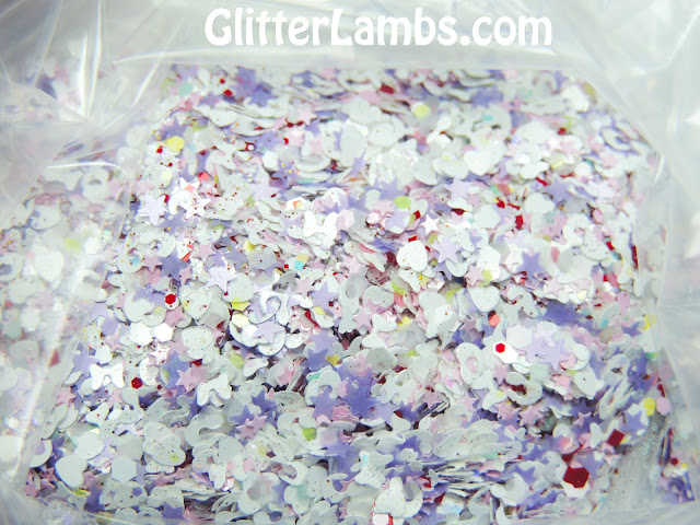 White opal iridescent hex, white bows, lavender stars, red and white hex, micro pink hex, micro iridescent glitters, pastel colored hex glitters in blues, yellows, and pink, Pink mini stars, white hearts, white leopard spot glitters, micro holographic burnt amber orange glitters.