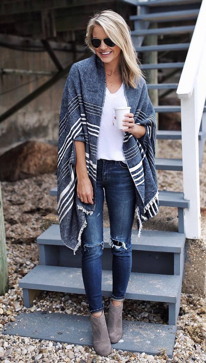 how to wear a striped poncho : white top + skinnies + boots