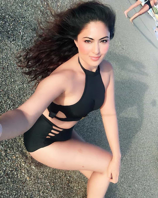 Nikesha Patel, the actress, radiates glamour and confidence in her latest hot photoshoot still.