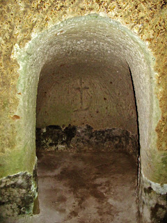 Early Christian carving in a cave of the San Rocco Via Cava near Sorano, Tuscany, Italy