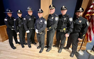 Pictured left to right: Academy Drill Instructor Detective Leanne Baker, Officer Andressa Rosa, Academy Drill Instructor Deputy Chief James West, Officer Christopher Gulla, Chief Thomas Lynch, Lieutenant Jason Reilly, Lieutenant Eric Zimmerman