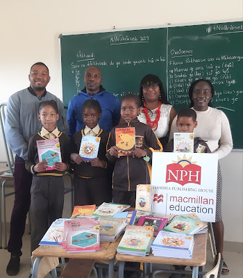 Learners and teachers at John Awaseb Primary School with textbooks donated by NPH