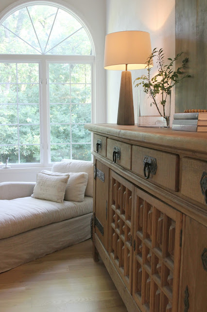 Rustic oak Belgian antique cupboard in European country styled living room by Hello Lovely Studio