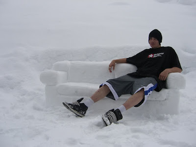 Guy enjoying snow with 'sofa'