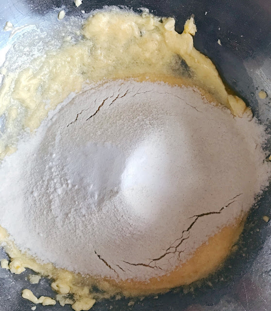 Flour and baking powder sieved into mixture